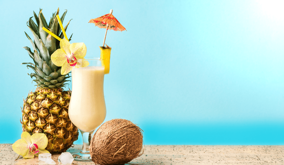 Blend together pineapple juice, cream of coconut, and ice
